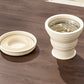 Pillen organizer met opvouwbare siliconen beker